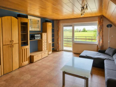 Wohnzimmer im Anbau im oberen Geschoss