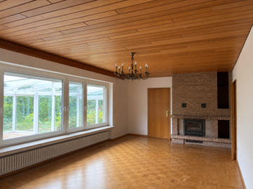 Wohnzimmer mit Kamin - Familienglück im Grünen – großzügiges Zuhause mit Potenzial *4294 G Einfamilienhaus in Gütersloh